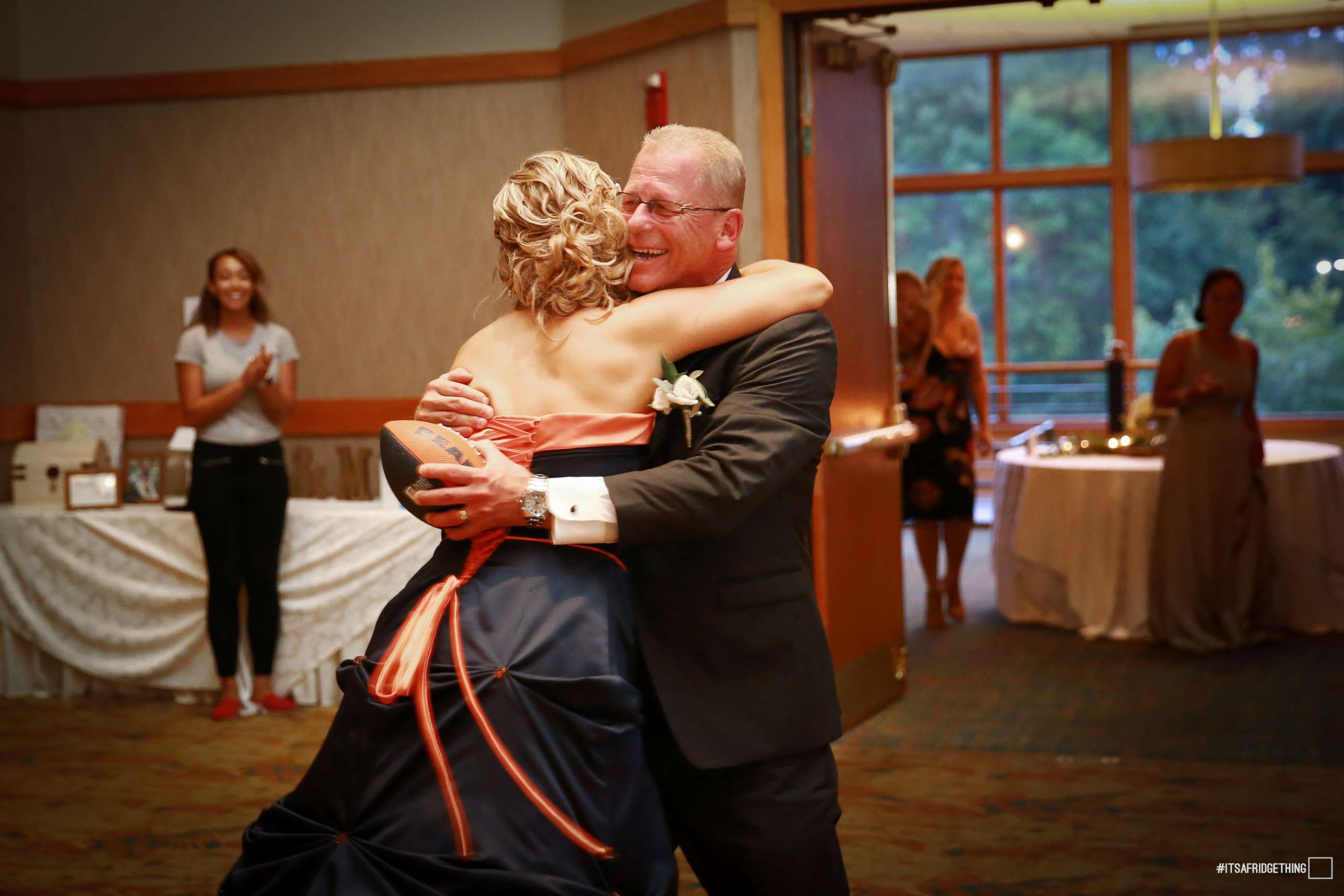 PHOTO: Brittney Harmon surprised her die-hard Chicago Bears fan father, Steve Benda, by wearing a team-themed dress at her wedding on July 22, 2017.