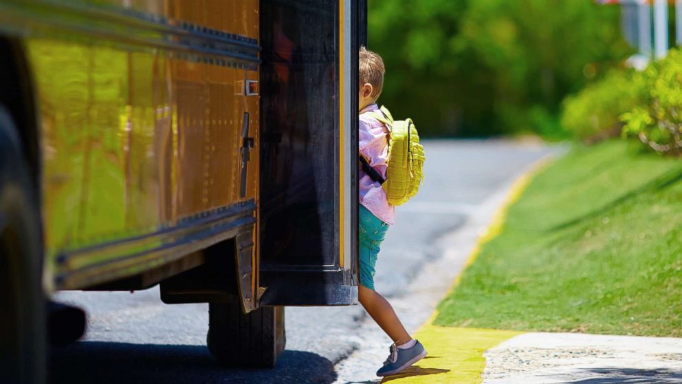 PHOTO: A young boy boards a school bus in an undated stock photo.