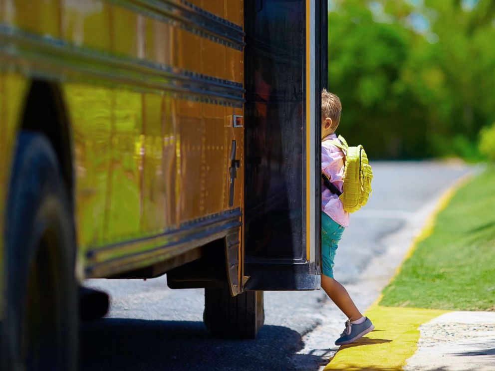 PHOTO: A young boy boards a school bus in an undated stock photo.