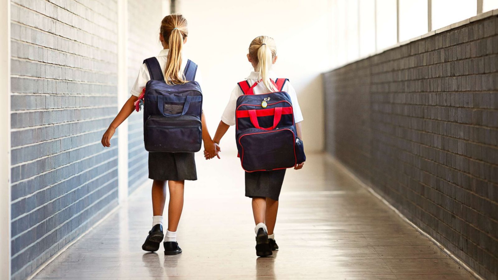 PHOTO: Schoolgirls walking hand in hand at a school hallway in this undated stock photo.