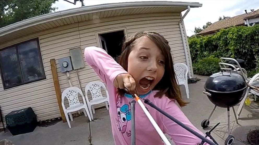 The video shows Alexis Davidson, 11, from Aurora Colorado preparing to fire the slingshot as a way of removing one of her last few baby teeth. 