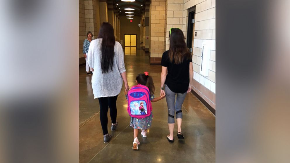 A photo of Haley Booth with her 4-year-old daughter Rachel, and her ex-husband's new girlfriend Dakota Pitman, went viral, inspiring thousands to coparent.