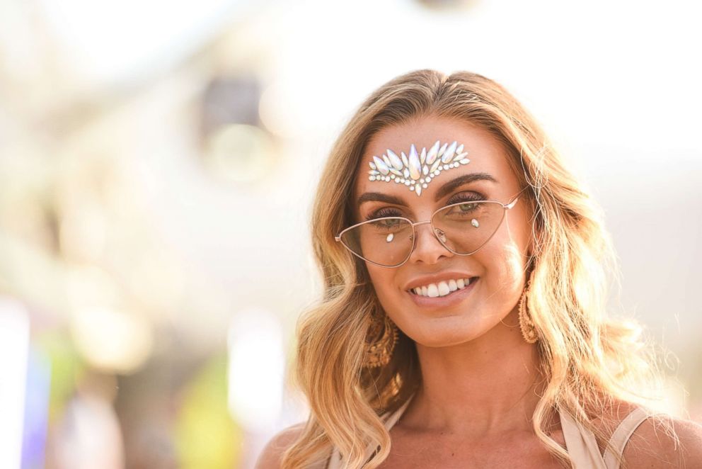 PHOTO: A woman decorates her face at the 2018 Coachella Valley Music And Arts Festival, Weekend 1, April 15, 2018, in Indio, Calif.