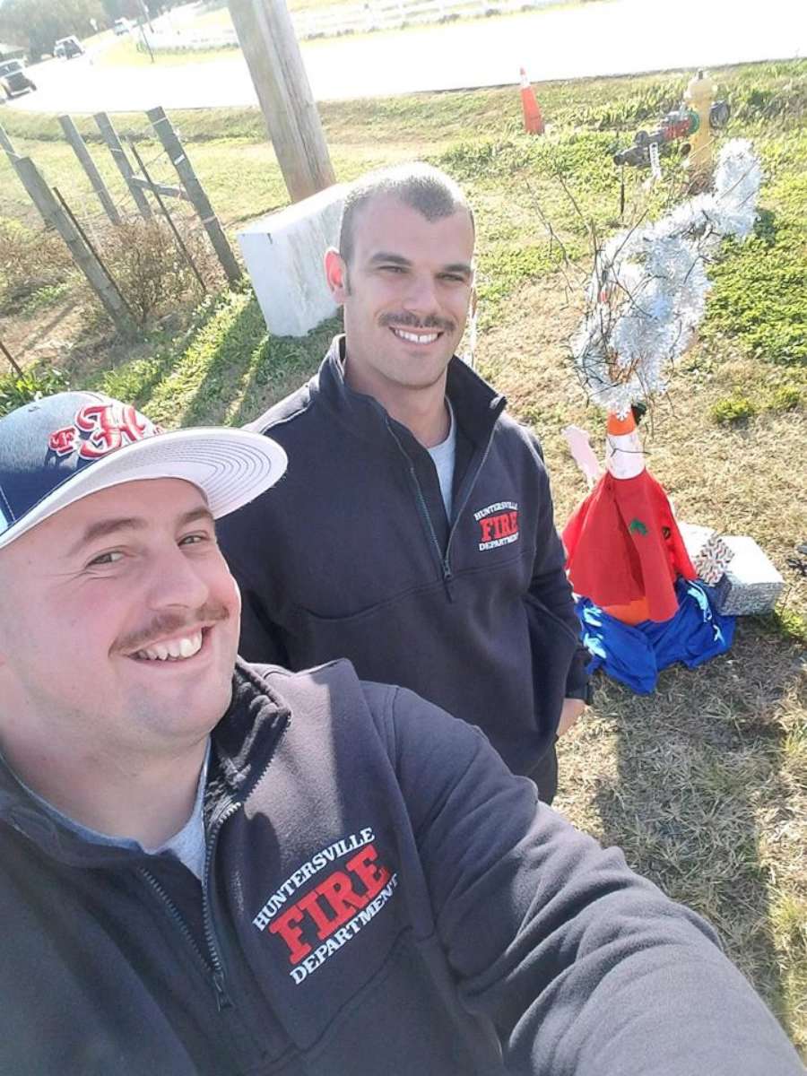 PHOTO: Huntersville Fire Department firefighters take pride in Cone Weed, posing with their unusual Christmas decoration.