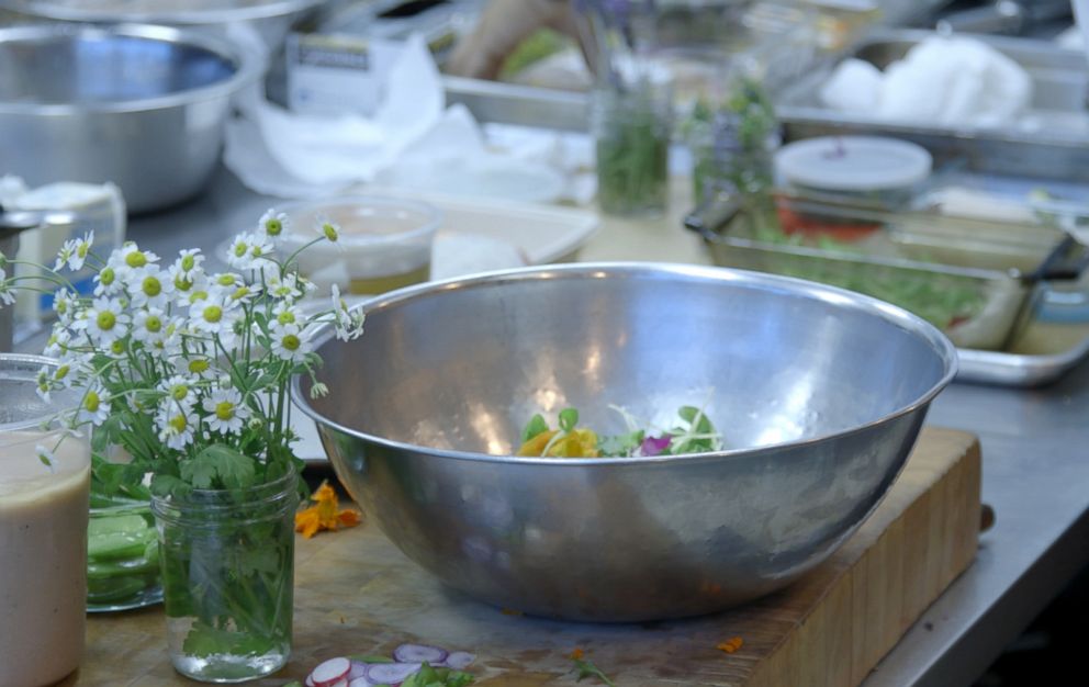 PHOTO: Edible flowers are added to enhance a summer salad.