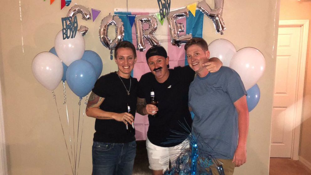 PHOTO: Corey Walker, center, seen with friend Erin Knoll, right, and his roommate Christina Craft at a party to celebrate Corey's transitioning to a male on May 24, 2018.