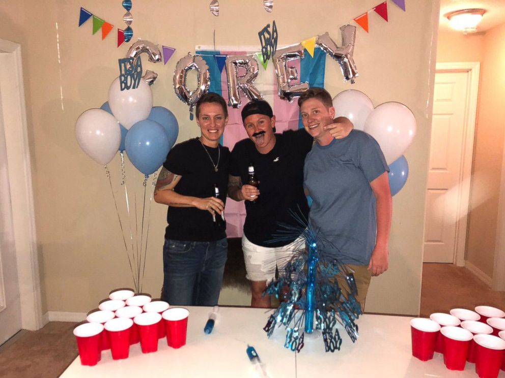 PHOTO: Corey Walker, center, seen with friend Erin Knoll, right, and his roommate Christina Craft at a party to celebrate Corey's transitioning to a male on May 24, 2018.