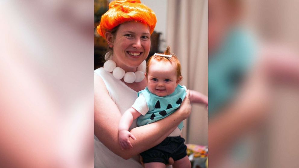 PHOTO: Catherine Burket poses with her daughter, Amelia Grace, dressed as Wilma and Pebbles Flintstone. 
