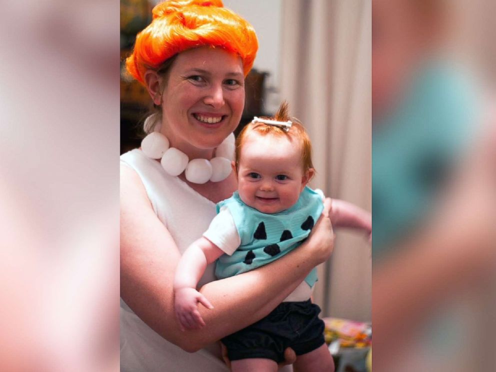 PHOTO: Catherine Burket poses with her daughter, Amelia Grace, dressed as Wilma and Pebbles Flintstone.