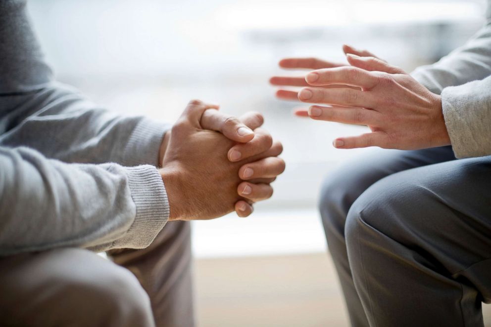 PHOTO: Stock photo of a couple, sitting, talking.