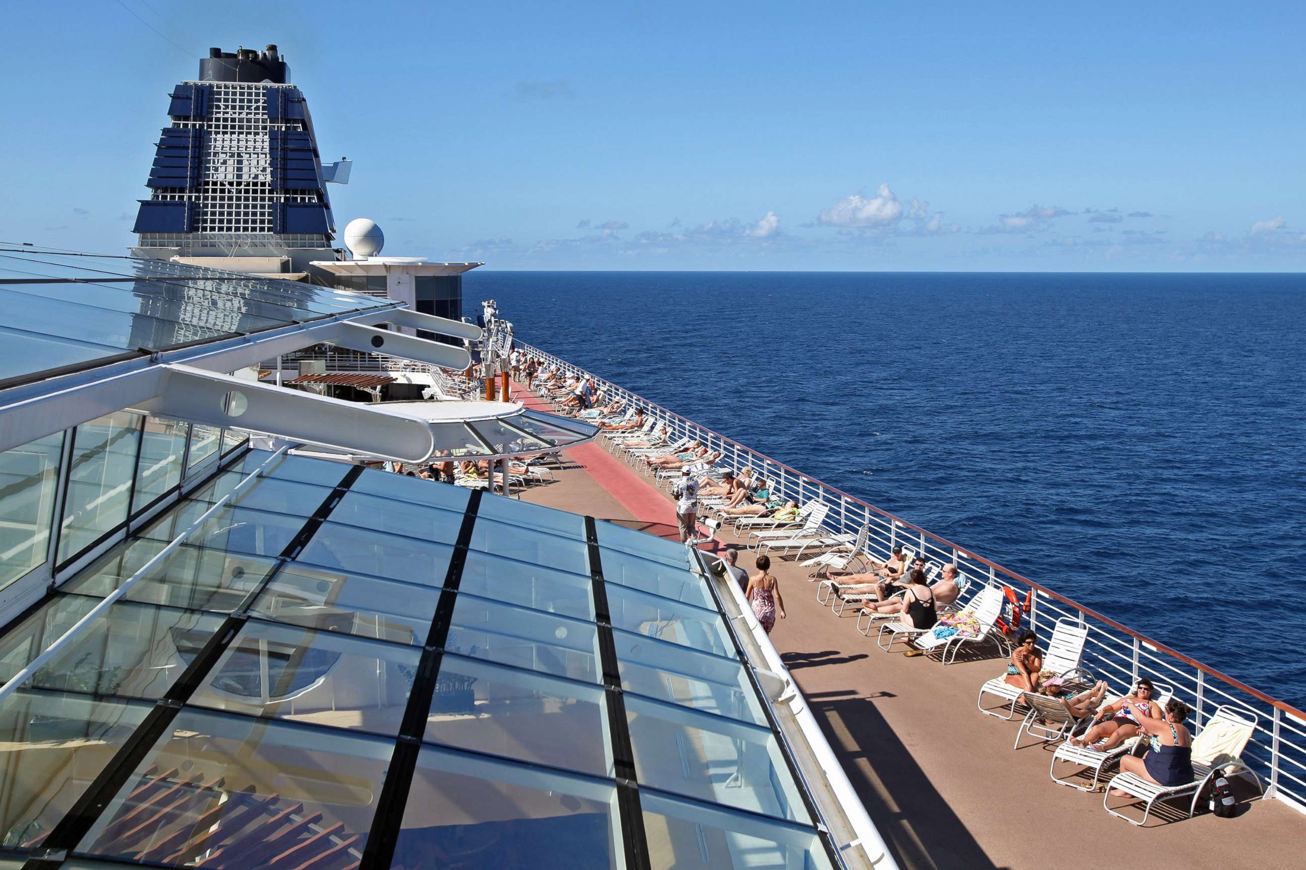 PHOTO: Passengers sunbathe aboard Celebrity Cruises Inc.'s Constellation in the Caribbean Sea near the coast of Cuba on Sunday, Dec. 16, 2012. 