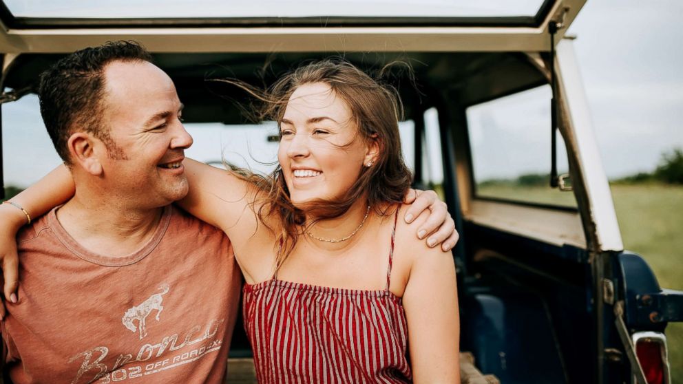 Premium Photo | A father and daughter pose for a photo with a smiling girl