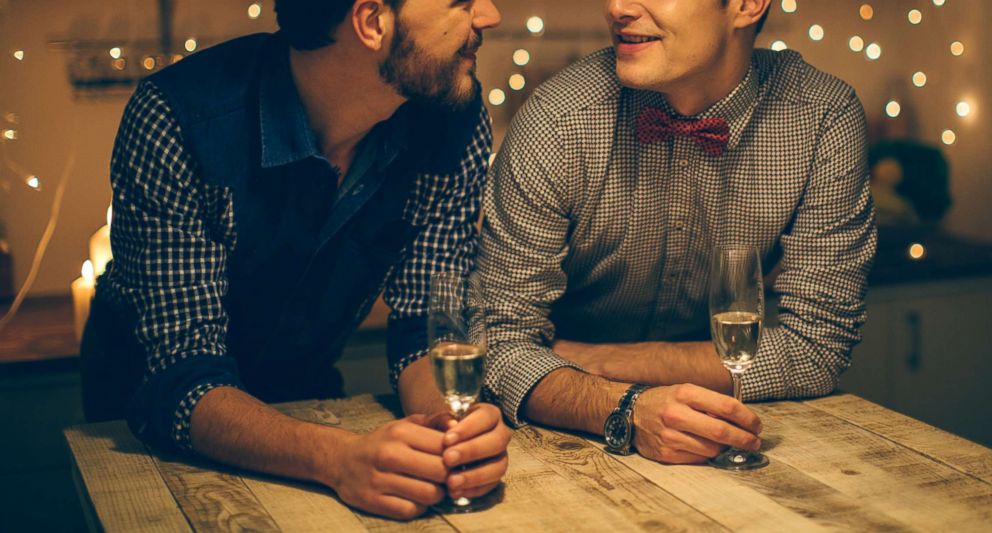 PHOTO: Two guys share a romantic date together. 