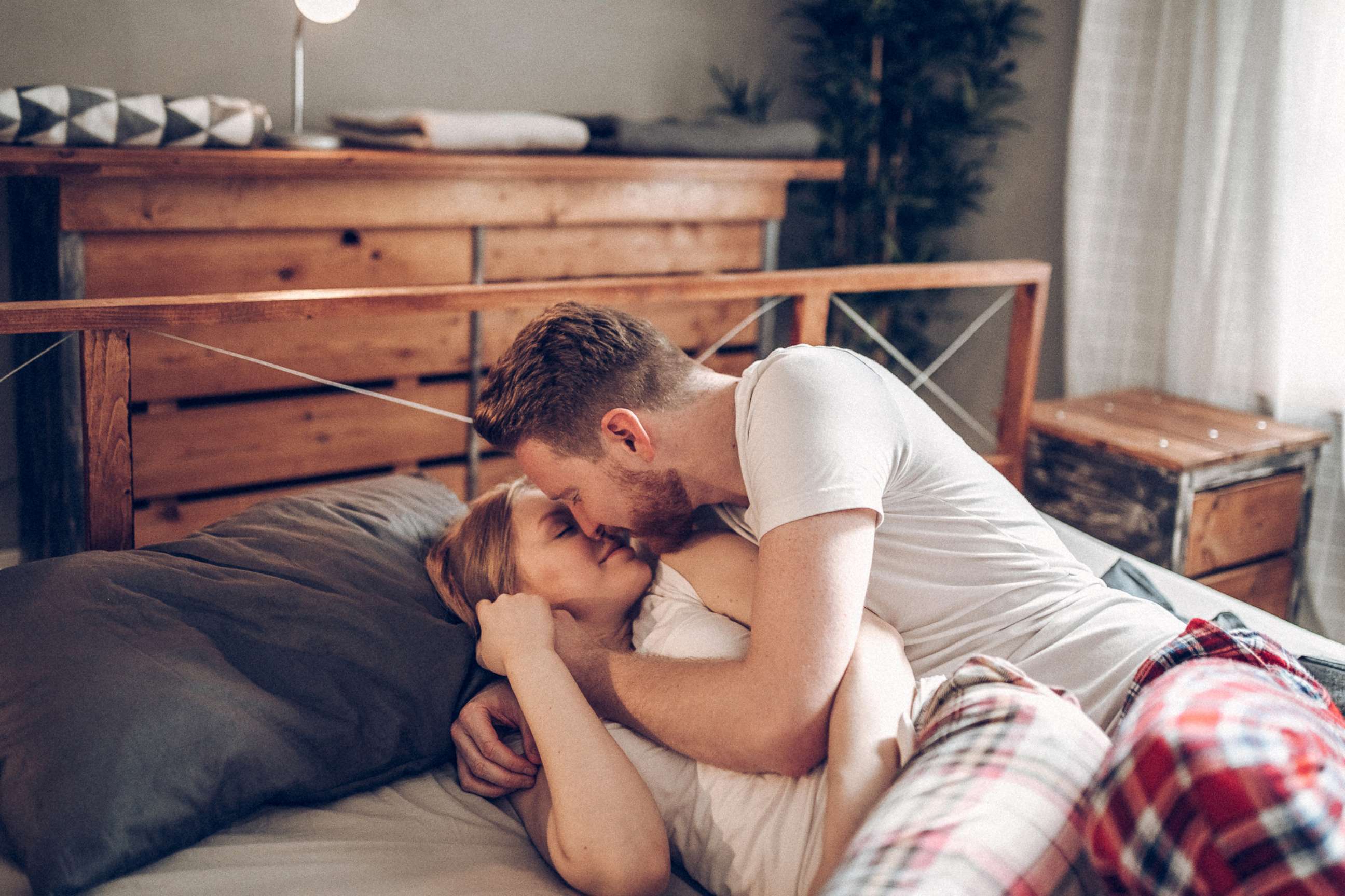 PHOTO: A couple lies together in bed in an undated stock photo.