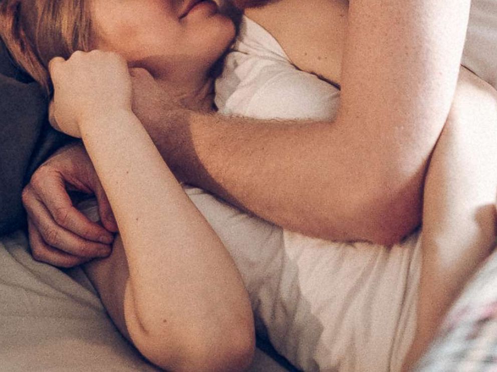 PHOTO: A couple lies together in bed in an undated stock photo.