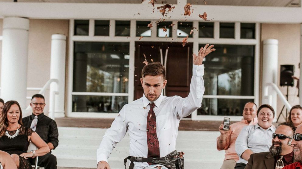 PHOTO: Jake Clark of Dayton, Ohio, served as his friends' flower man, throwing fall foliage out of fanny packs on Oct. 7.