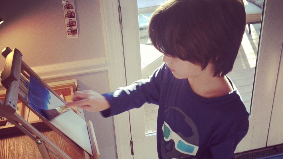 PHOTO: Teague Dillon paints in his family's home in this undated family photo.