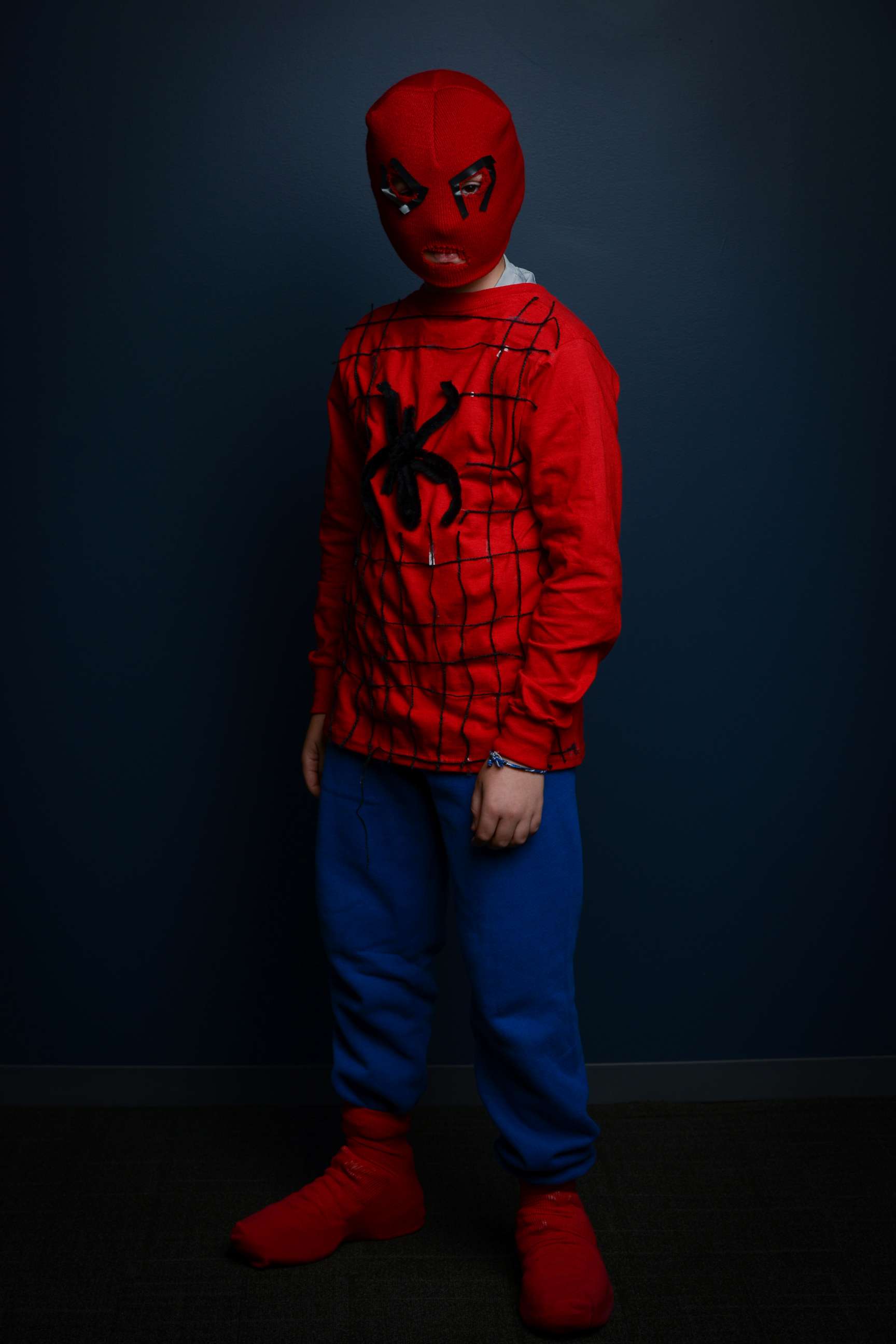 PHOTO: To create this Spider-Man look, use an adult-sized red snow hat and cut out holes for the eyes and the nose.