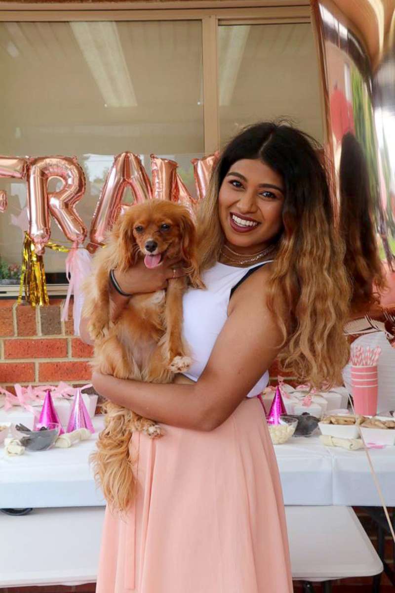 PHOTO: Chami Rupasinghe, 20, of Australia, poses with her beloved dog Frankie at her puppy birthday party.