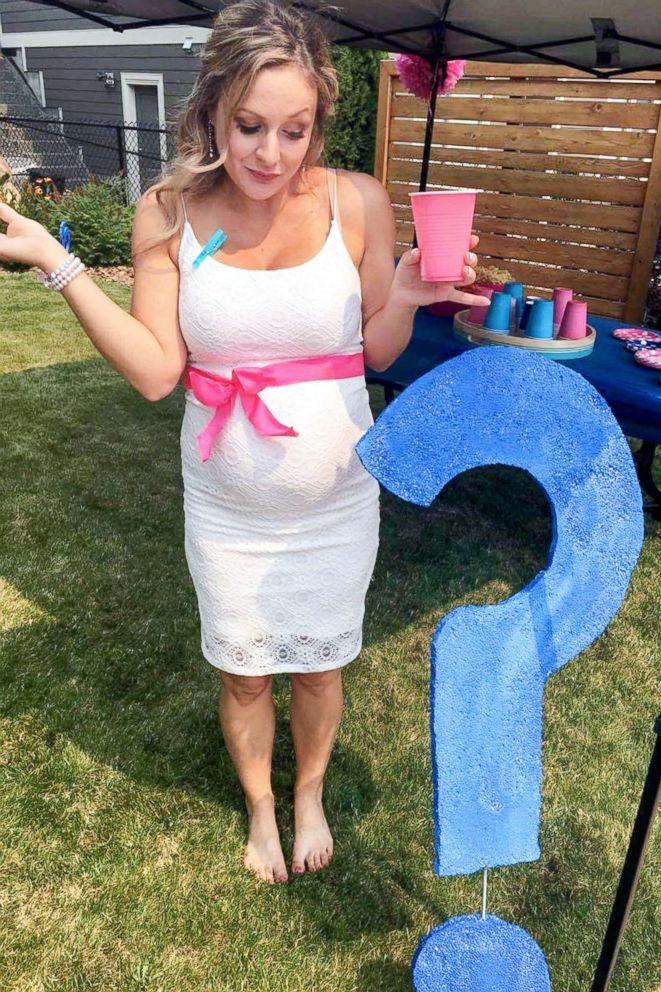 PHOTO: Brooke Holton, stands next to a blue question mark during the party.