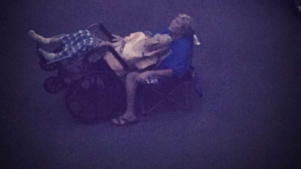 PHOTO: Hedy Morrison of Nashville, Tenn., helped her elderly father witness the total solar eclipse while tilting his wheelchair back. 