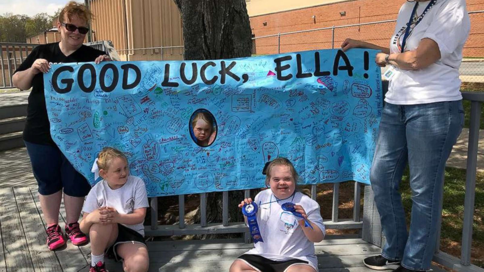 PHOTO: Ella Chambers, bottom right, with the sign made for her by her schoolmates at Hazel Grove Elementary.