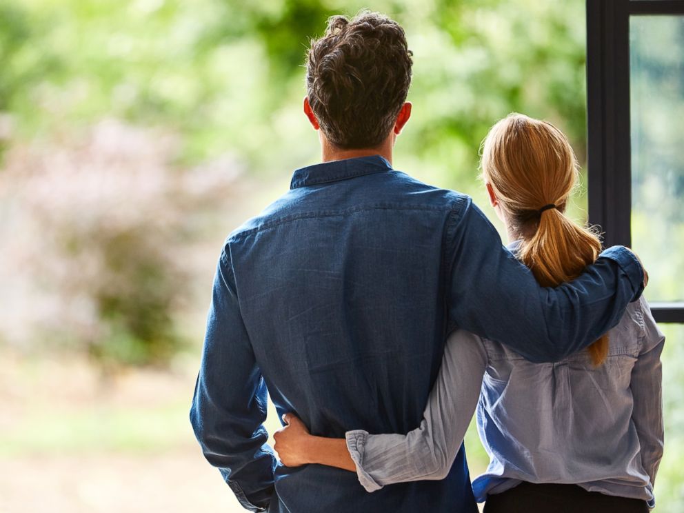 PHOTO: A couple looks at the view outdoors from their home in this undated stock photo.