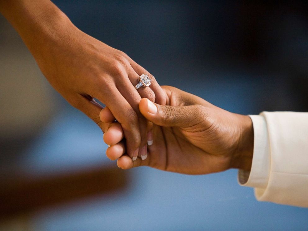 PHOTO: A man and woman hold hands showing off a large diamond ring in this undated stock photo.
