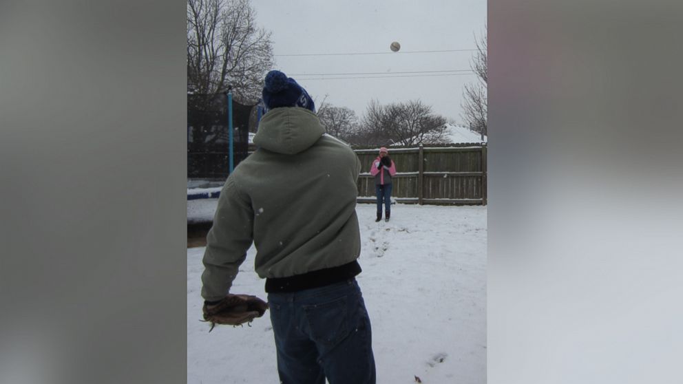 Ethan Bryan plays catch with Jamie Bryan.