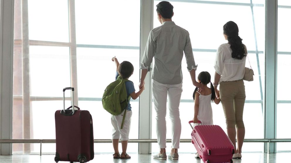 A family is pictured at the airport in this undated stock photo.