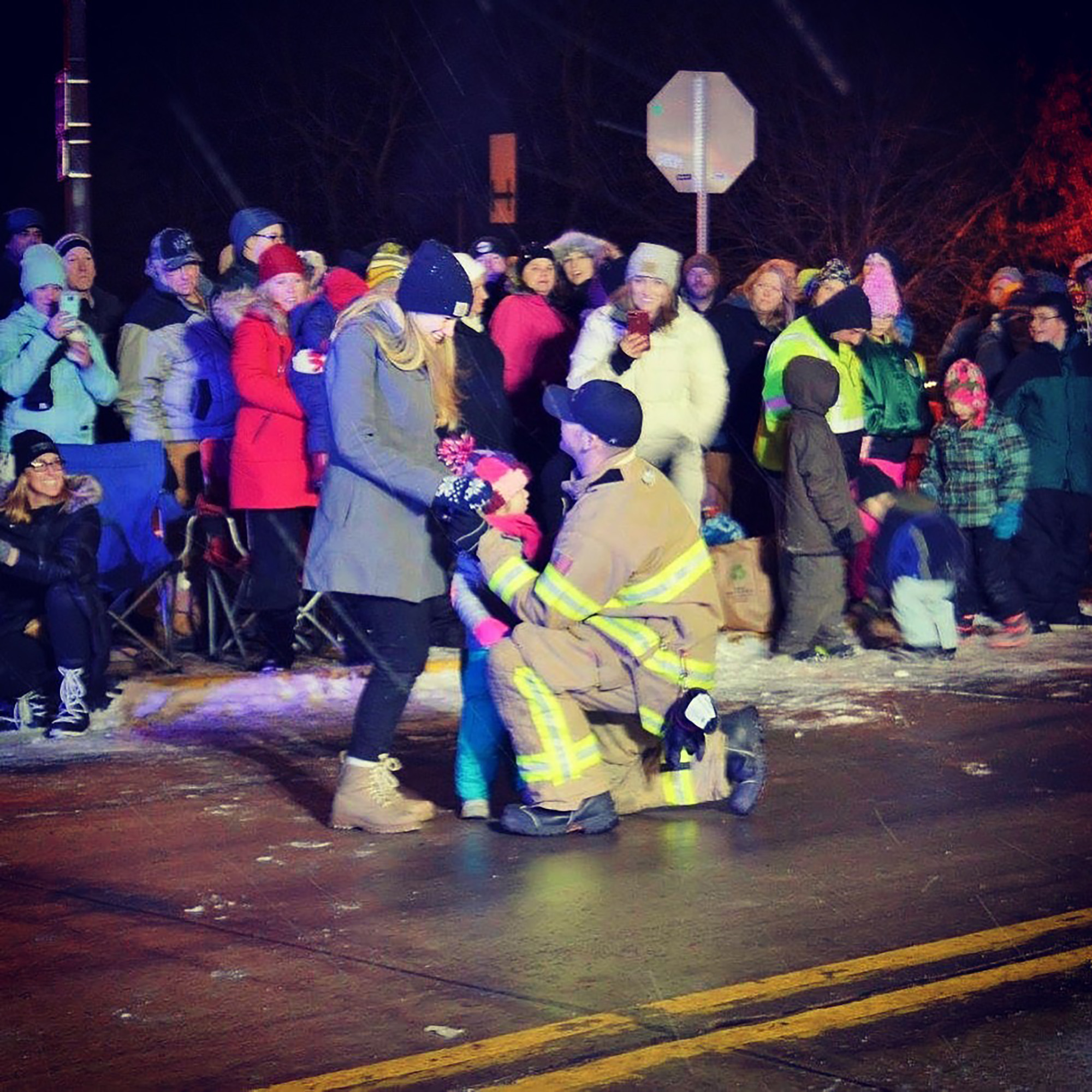 PHOTO: Matt Poliak of the Menomonie Fire Department in Wisconsin proposed to his girlfriend, Grace Johnson, and her daughter, Isla, at the town's Christmas parade on Dec. 14, 2017.