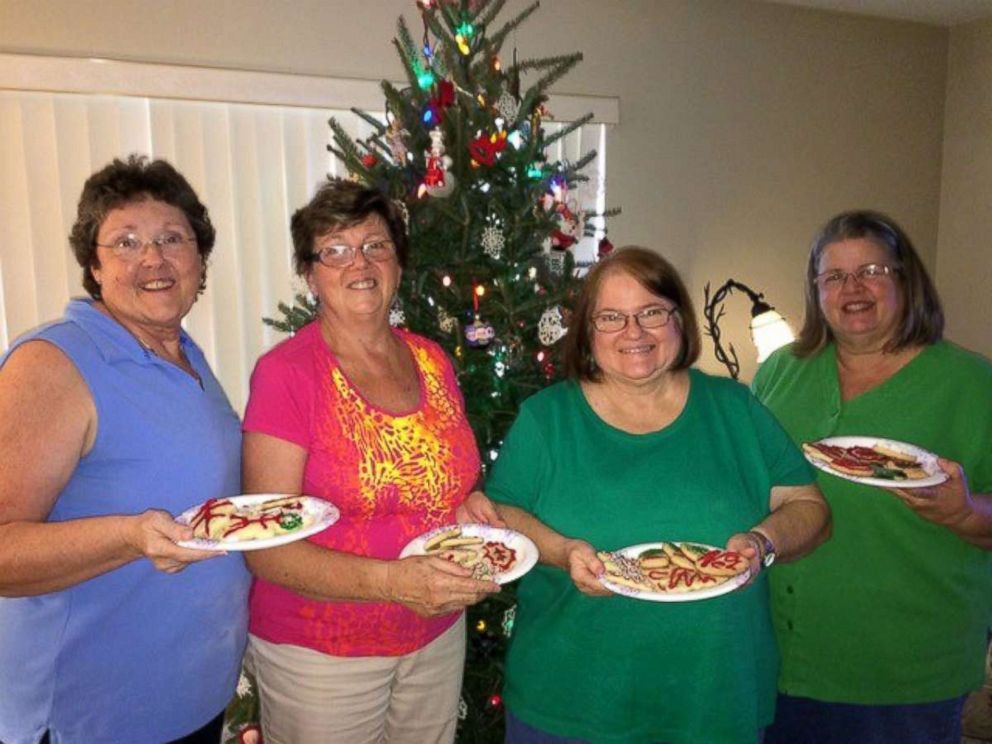 PHOTO: Jody Gleason, Anne Reynolds and Joyce Johnston pose with a fourth friend in this undated photo at the friends' annual holiday cookie baking event.