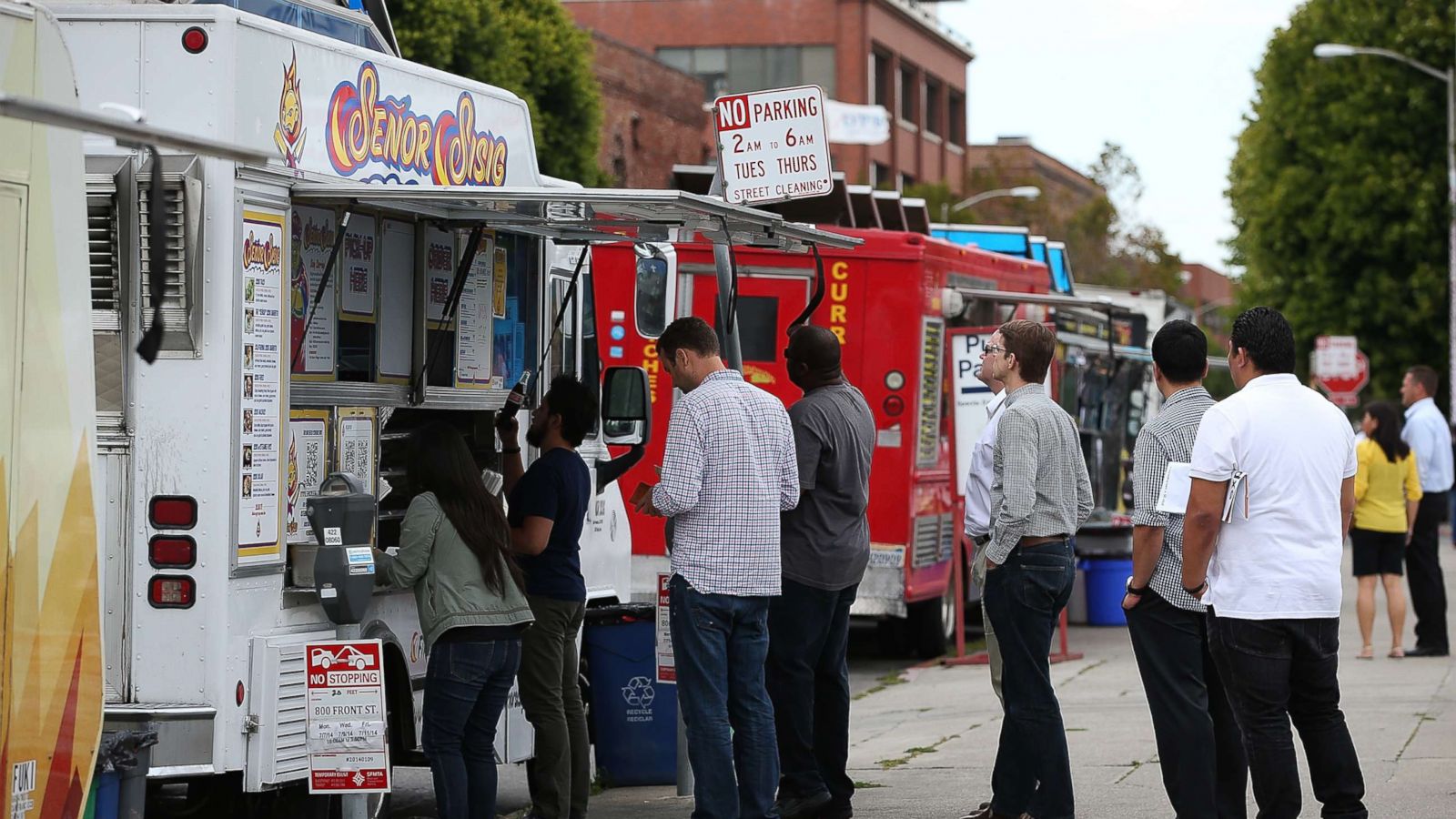 PHOTO: Customers line up to order food from food trucks on July 7, 2014 in San Francisco.