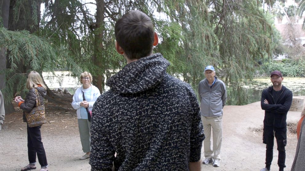 PHOTO: Participants listen to Ben Page at a forest therapy session at the Los Angeles County Arboretum and Botanic Garden.