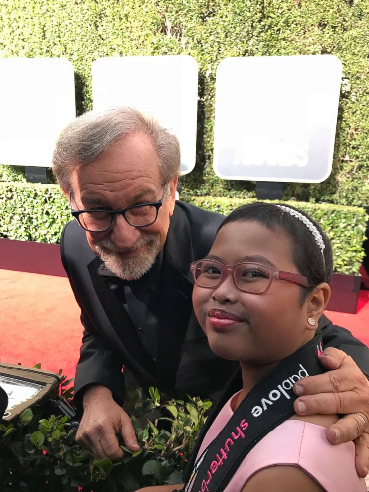 PHOTO: Francine Gascon, 10, poses with director Steven Spielberg as she takes photos of stars on the Golden Globes red carpet. 
