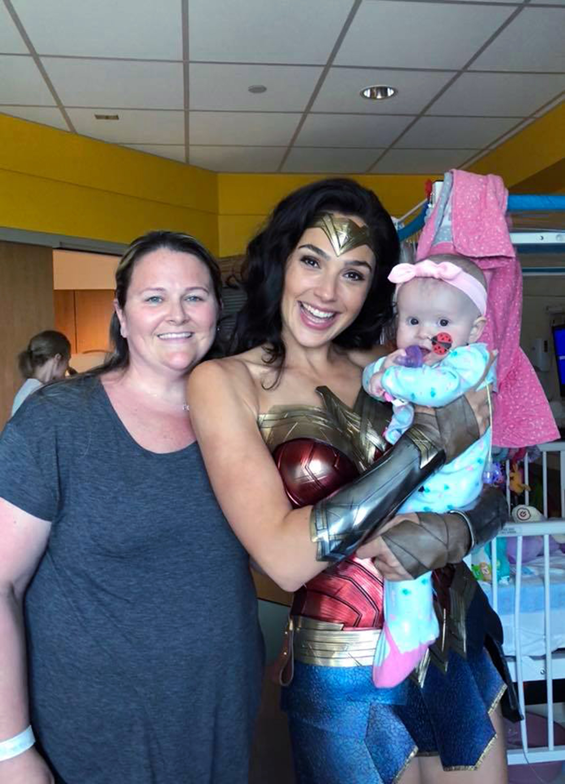 PHOTO: Actress Gal Gadot poses for a photo with Kelly Swink Sahady while holding 7-month-old Karalyne Sahady, who is being treated for acute myeloid leukemia, at Inova Children's Hospital in Falls Church, Va., July 6, 2018.