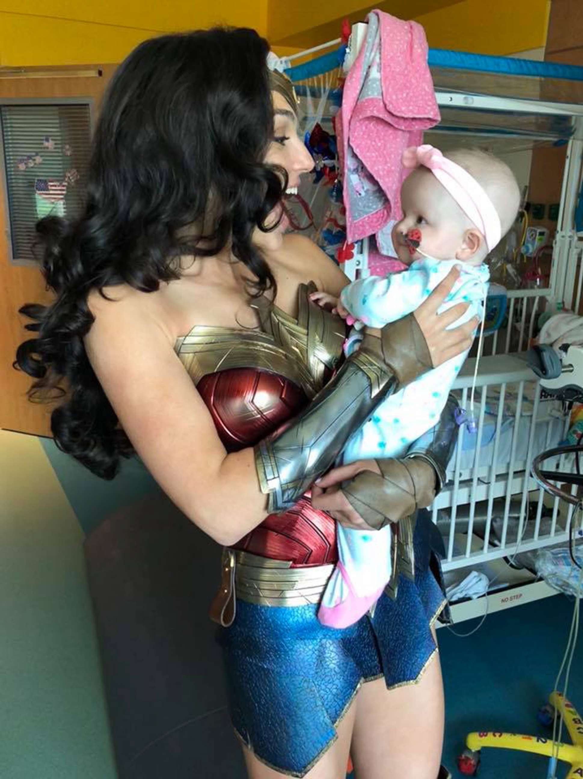 PHOTO: Actress Gal Gadot holds 7-month-old Karalyne Sahady, a patient at Inova Children's Hospital in Falls Church, Va., July 6, 2018. 