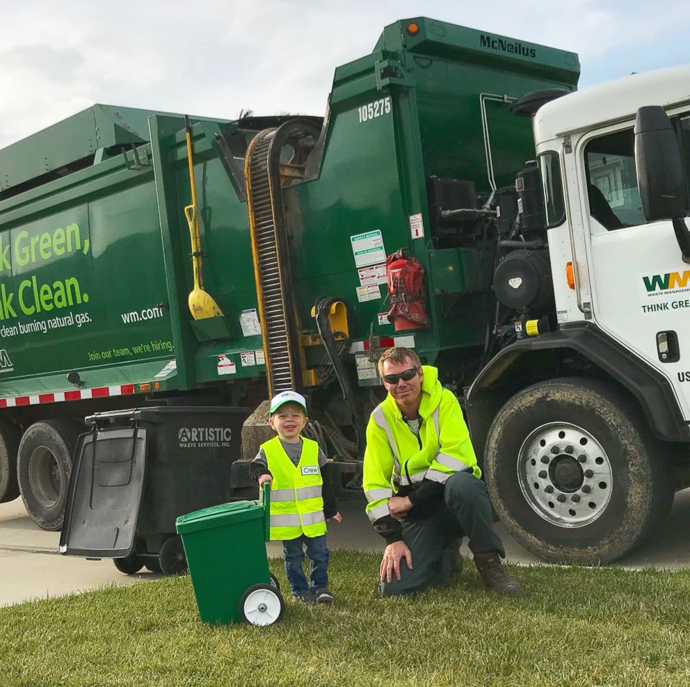 PHOTO: Crew Smith, 3, of Iowa, waits every Thursday to greet his local sanitation workers.