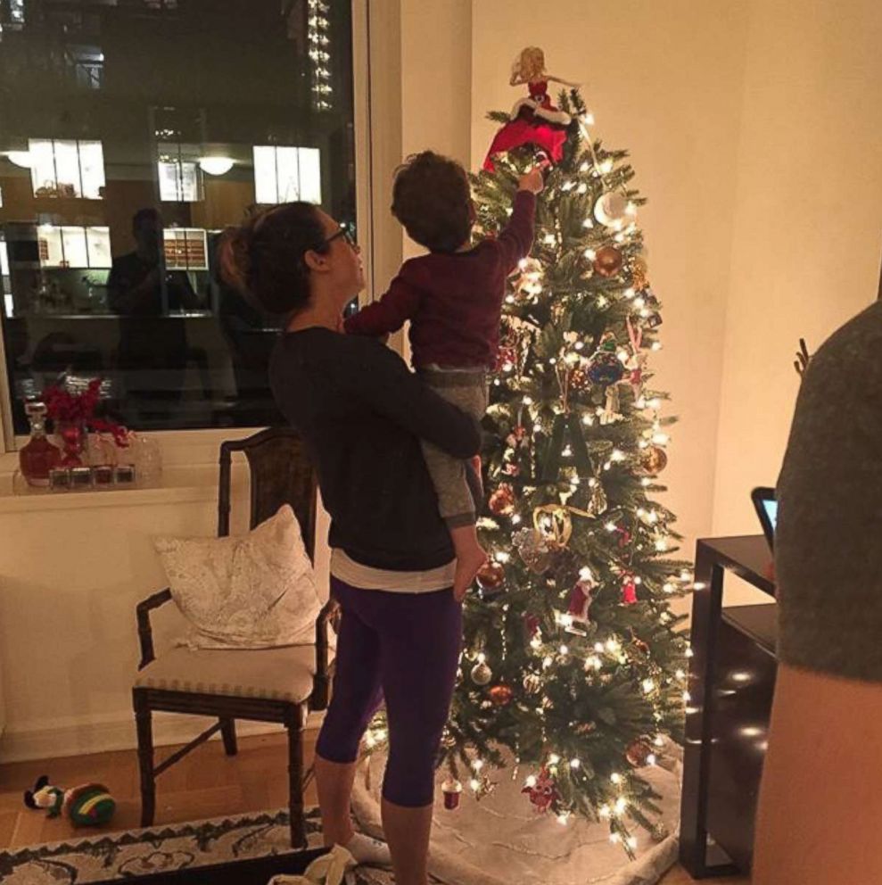 PHOTO: ABC News chief meteorologist Ginger Zee and her son, Adrian, decorate their family's Christmas tree.