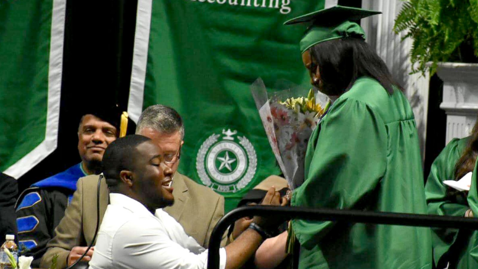 PHOTO: Joshua Okpara dropped down to one knee and proposed to Charmecia Goree at University of North Texas' May 11, 2018 graduation.