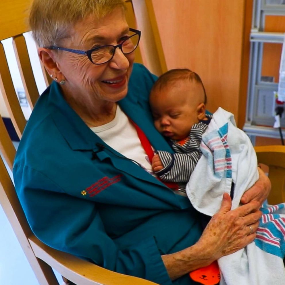 VIDEO: This woman has no children but is known as the 'Grandma Cuddler'