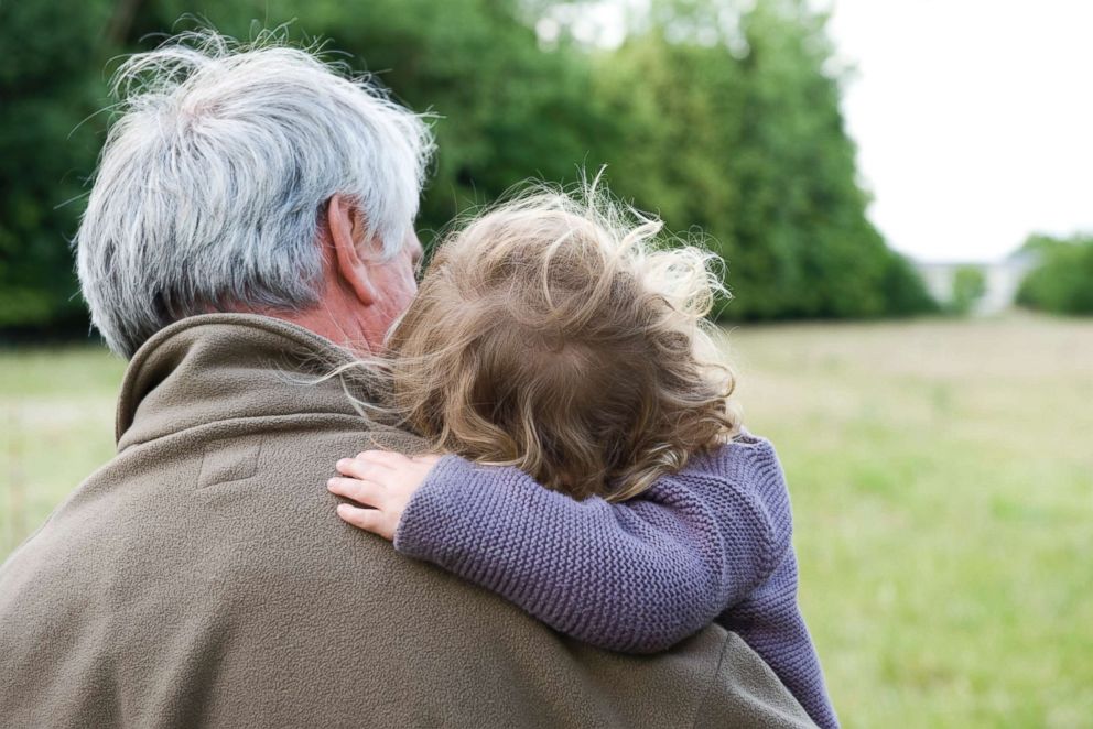 PHOTO: A grandfather holds his granddaughter in an undated stock photo. 