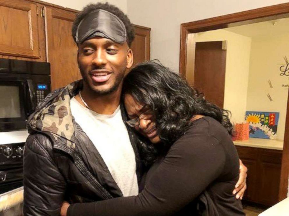 PHOTO: Grant Jackson, an airman, surprised his mom, Gwen Jackson, home from his deployment to Japan on Dec. 18, 2017.