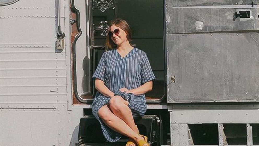 PHOTO: Jessie Lipskin sits on the steps of the chic RV she converted from a Greyhound bus.