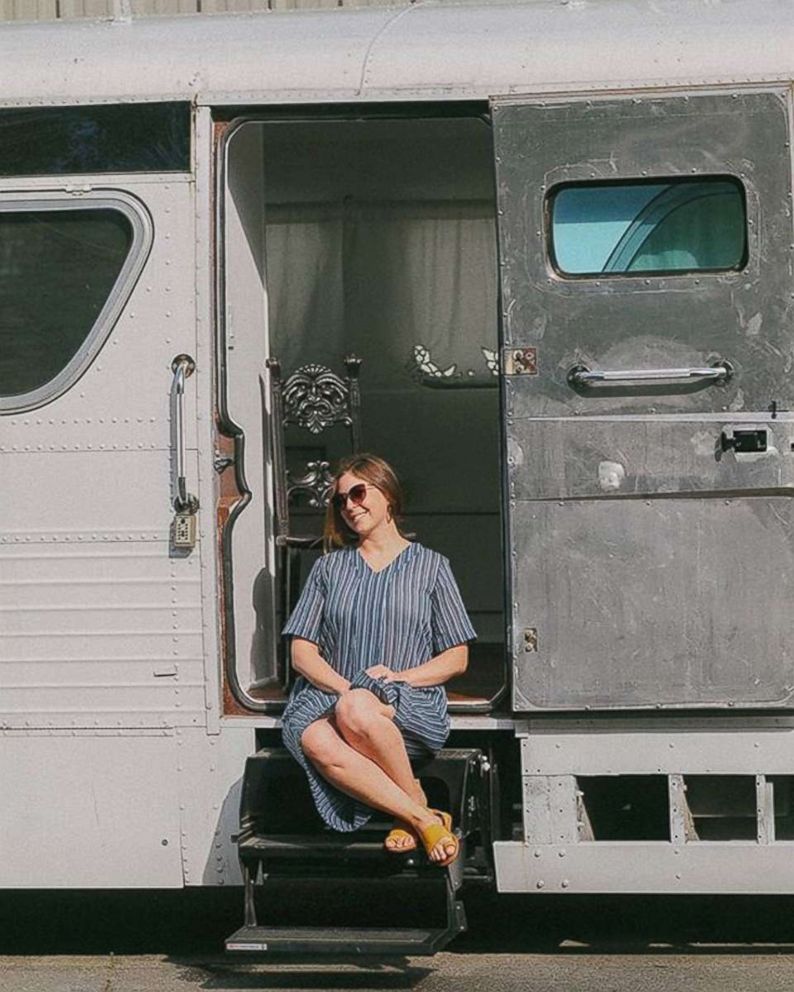 PHOTO: Jessie Lipskin sits on the steps of the chic RV she converted from a Greyhound bus.