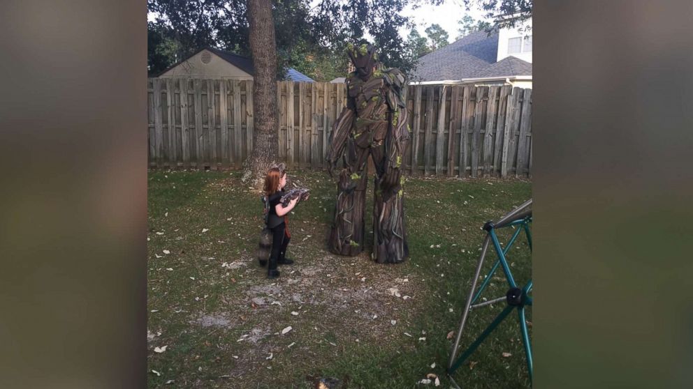 PHOTO: Tim Burket and daughter, Amelia Grace, test our their Halloween costumes in the backyard.