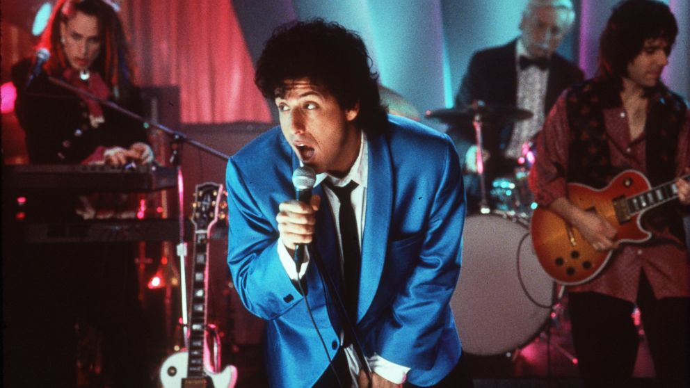 Adam Sandler sings in a scene from the film 'The Wedding Singer', 1998.