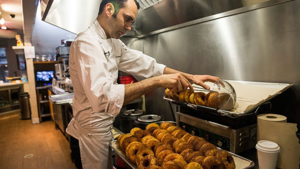 Chef Dominique Ansel deep fries a croissant-doughnut hybrid, known as the "cronut" at Dominique Ansel Bakery on June 10, 2013 in New York City.