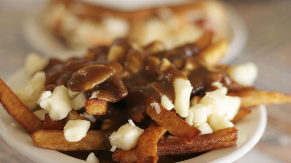 Poutine, French for "hot mess," is traditionally French fries topped with cheese curds and gravy.