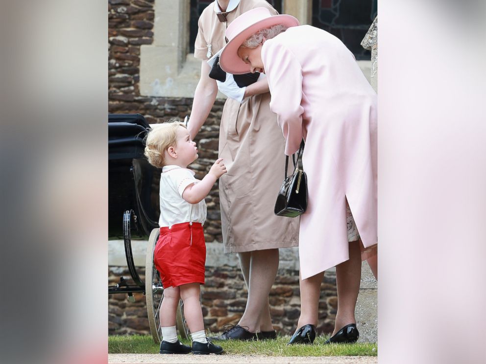PHOTO: Prince George of Cambridge talks to Queen Elizabeth II outside the Church of St Mary Magdalene on the Sandringham Estate for the Christening of Princess Charlotte of Cambridge on July 5, 2015 in King's Lynn, England.